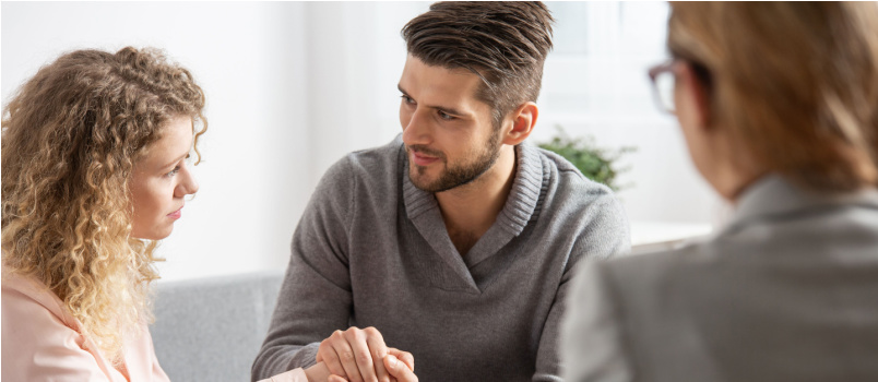 Man comforting sad woman