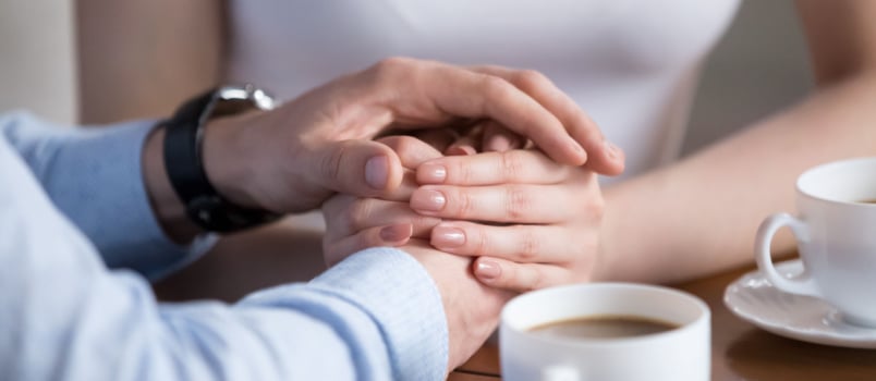 Couple holding each other hands