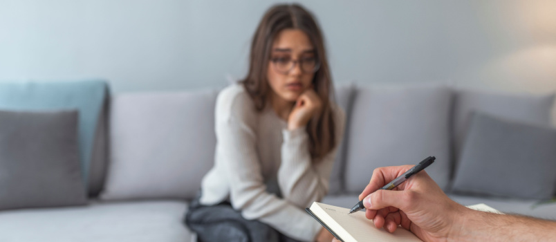 Woman having therapy session with psychologist