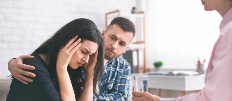 Man comforting sad wife