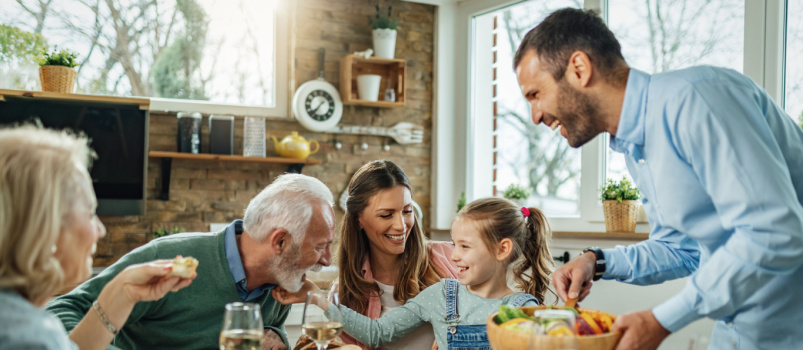 Happy family having meal together