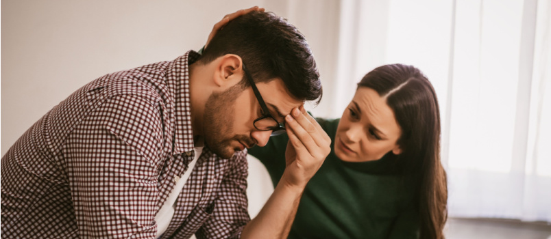 Woman comforting sad man