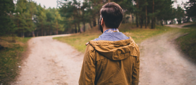 Man standing alone on road