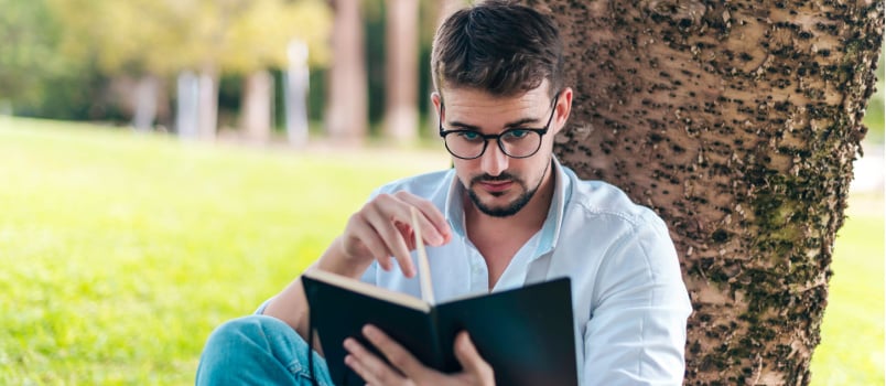 Man writing notebook ideas