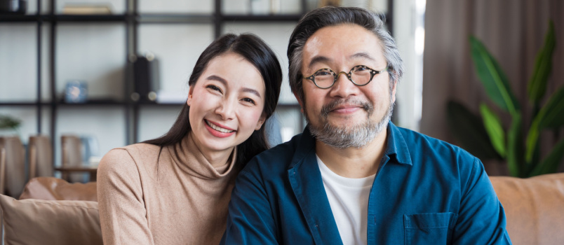 Young couple smiling looking in camera
