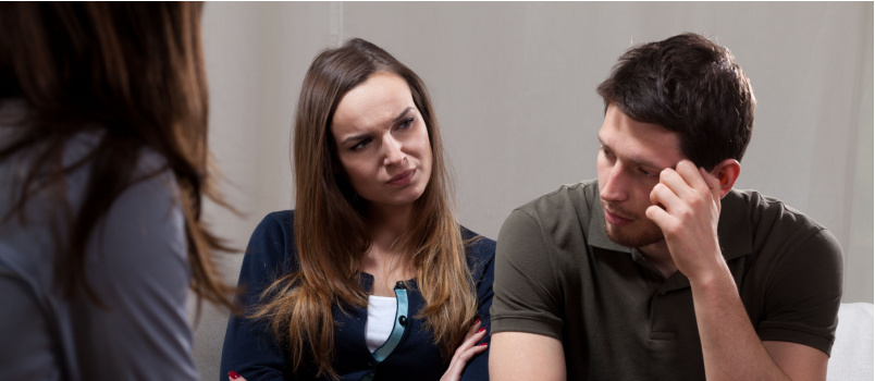 Couple sitting with psychologist