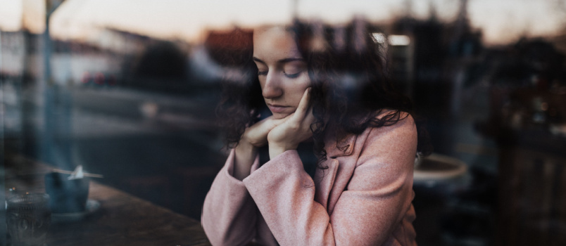 Woman sitting alone having coffee