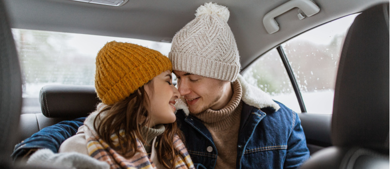 Happy smiling couple in car