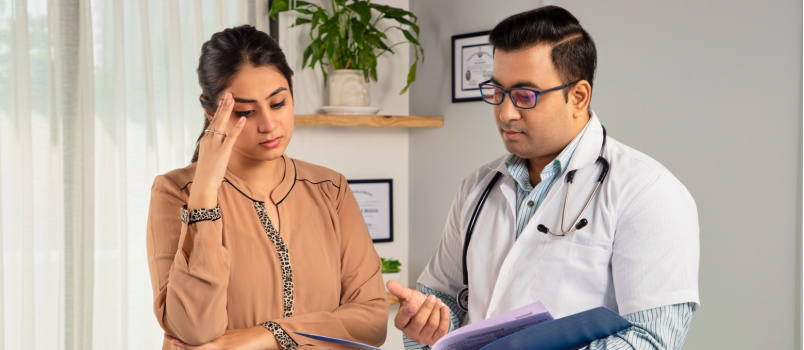 Woman consulting doctor