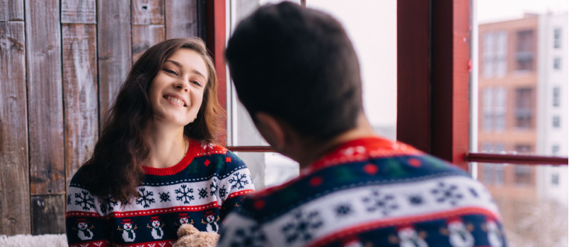 Happy couple wearing same sweater