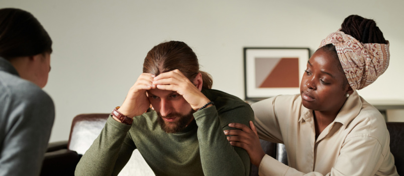 Worried man talking to psychologist