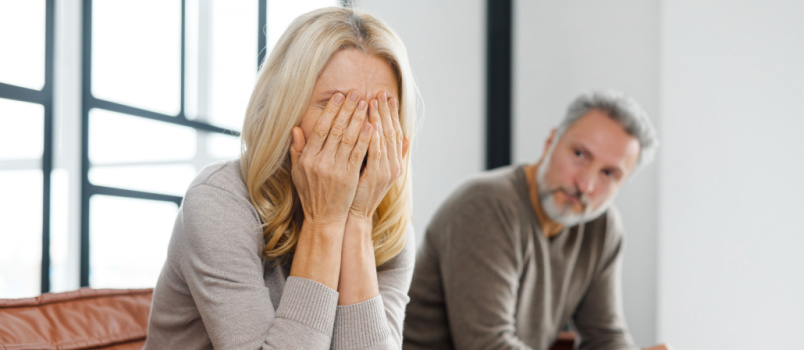 Upset middle aged arguing at home