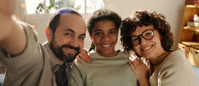 Happy family smiling taking selfie