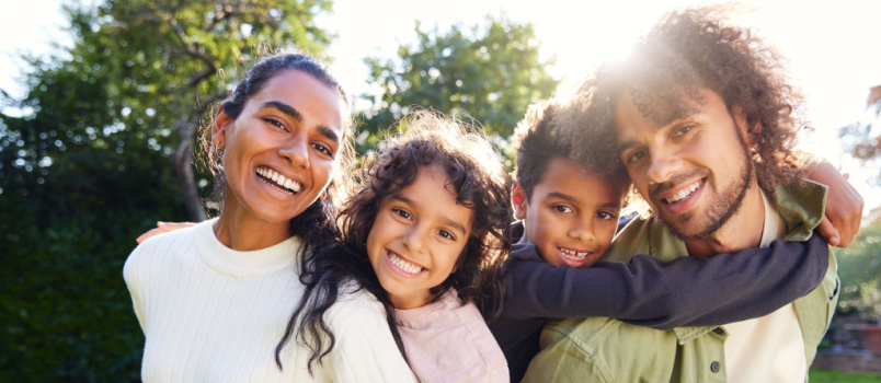 Parents giving their kids piggybacks