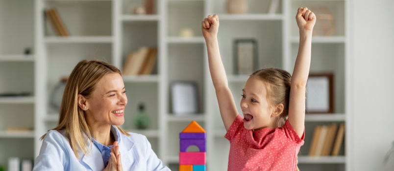 Cute little girl with development specialist