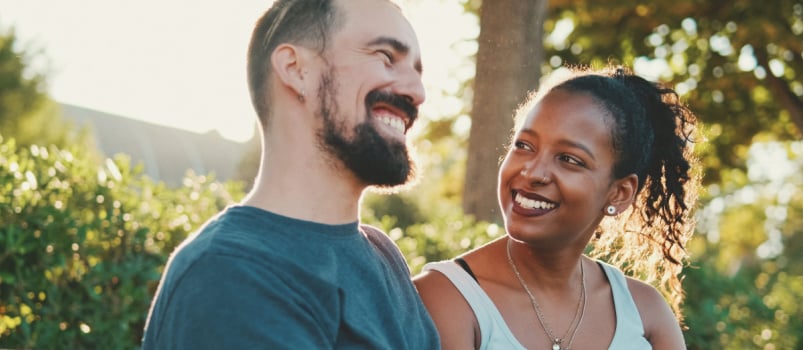 Couple talking sitting on bench