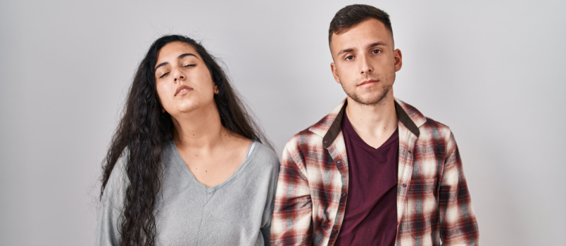 Panic couple standing on white background