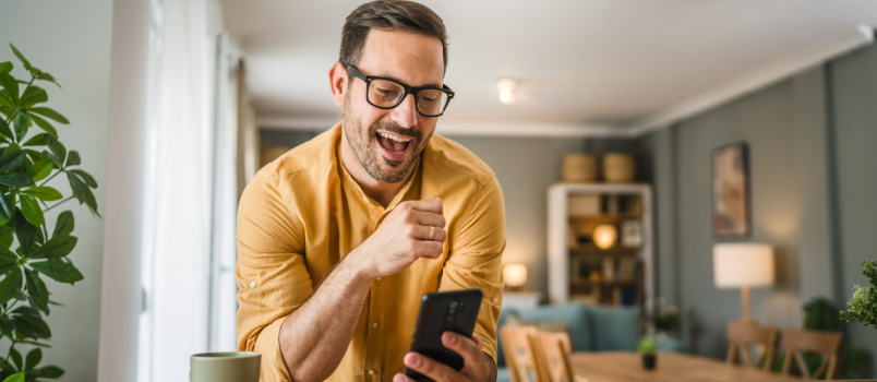 Happy man texting