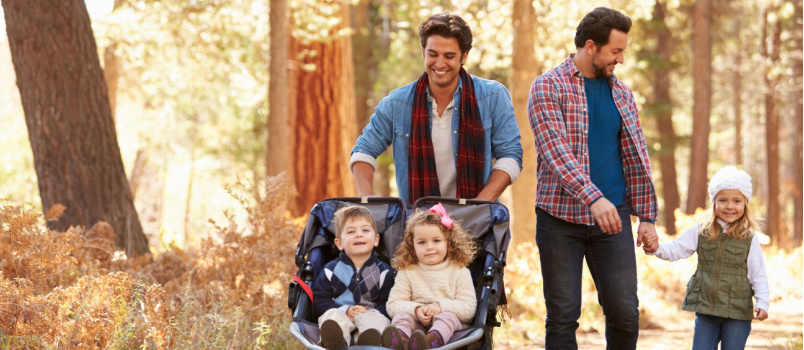 Male guy pushing children buggy