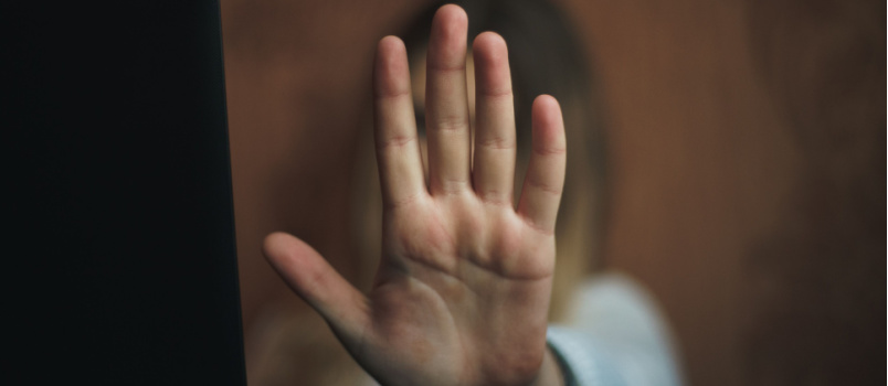 Woman saying no by doing hand gesture