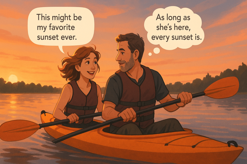 Couple kayaking at sunset