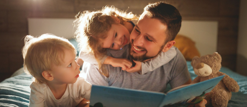 Father and kids reading books