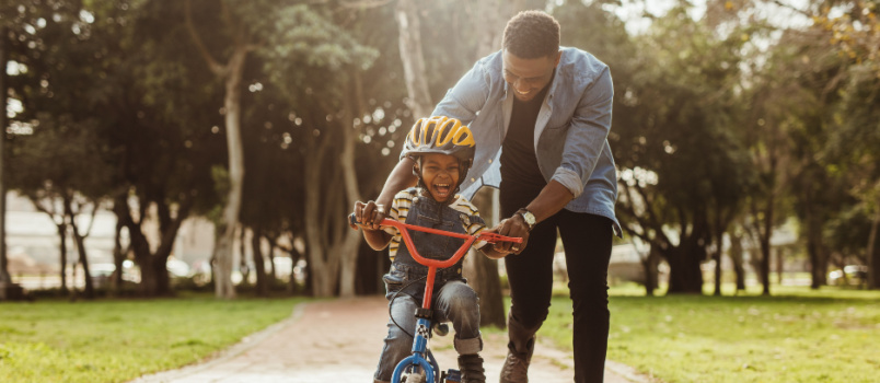 Boy learning riding cycle