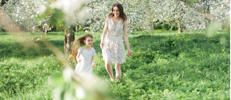 Mother and daughter playing in garden
