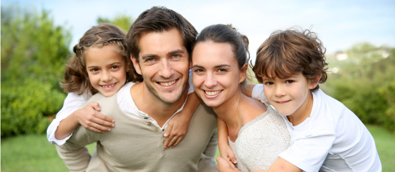 Parents giving piggy back to kids