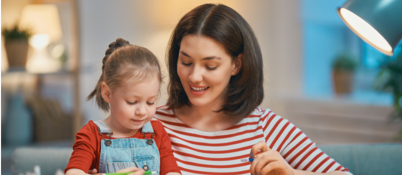 mother and daughter drawing together