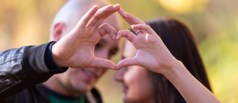 Couple making heart shape