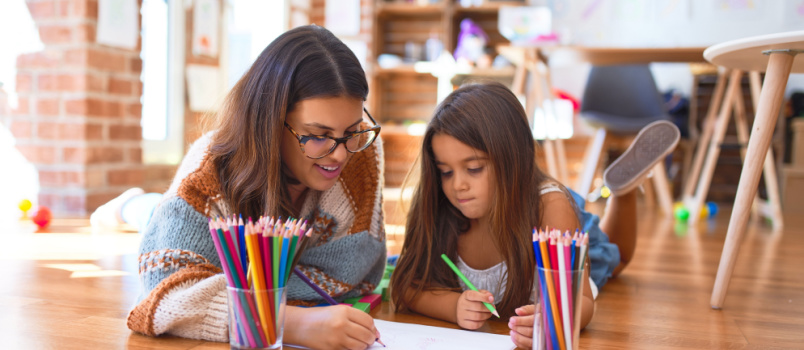 Woman helping her daughter