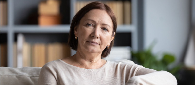 Peaceful woman sitting on couch