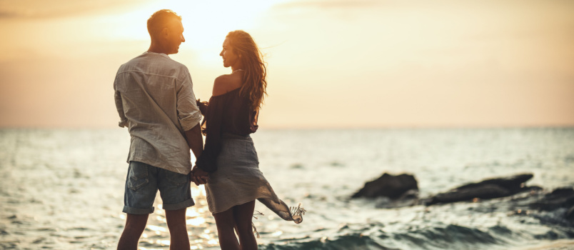 Loving couple enjoying near beach