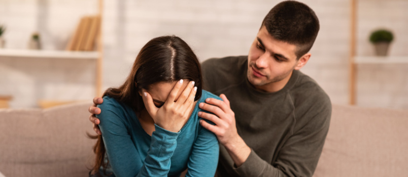 Man consoling sad wife