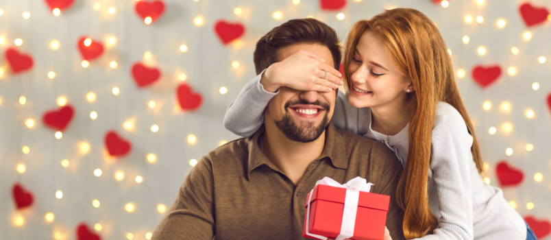 Surprising man with gift box