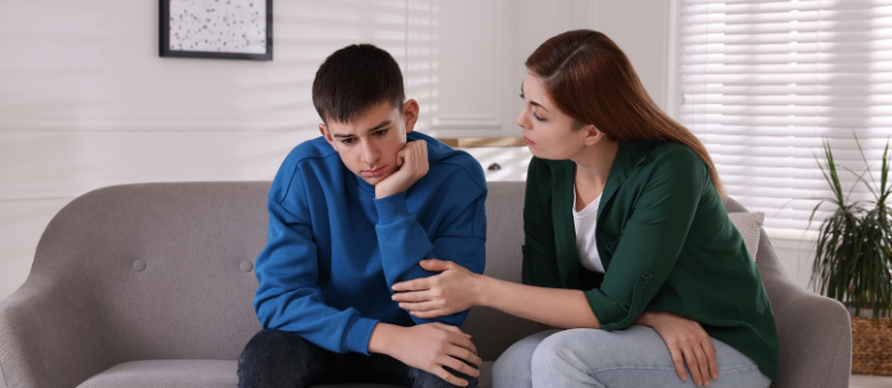 Mother consoling her son