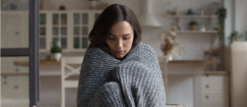 Sad wrapped young woman