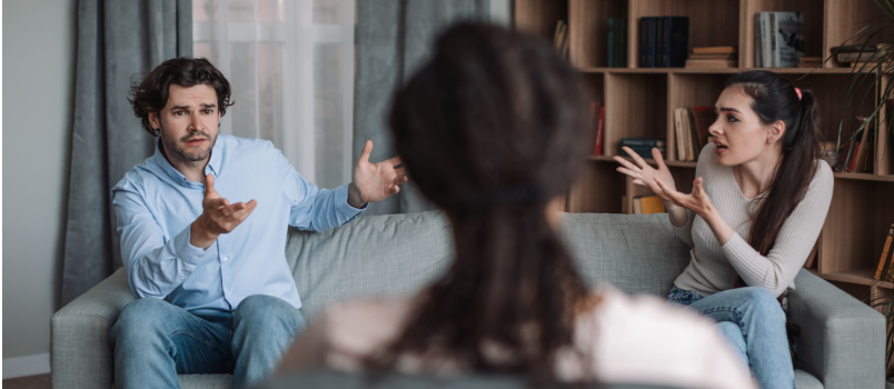Couple having conversation with psychologist