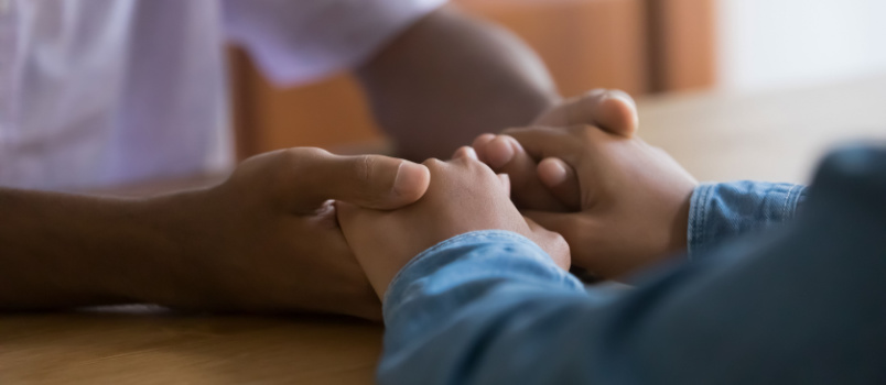 Couple holding each other hands