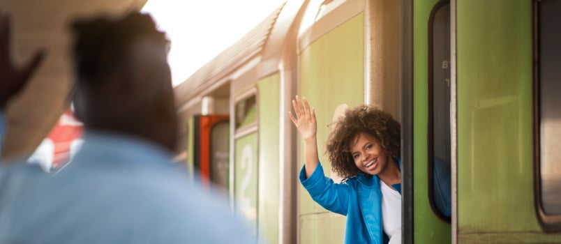 Woman waving to her boyfriend