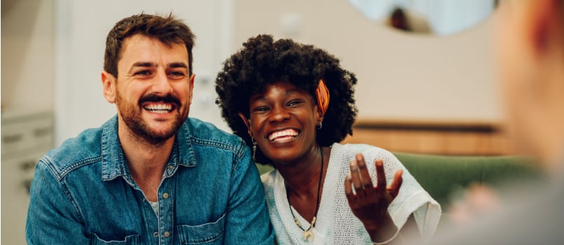 Young smiling while talking to therapist