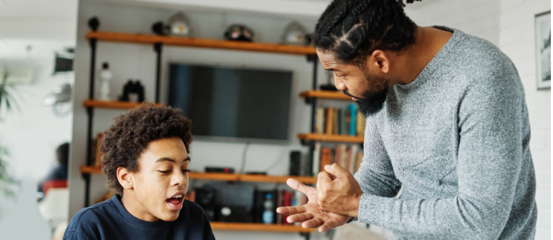 Father and son doing homework together