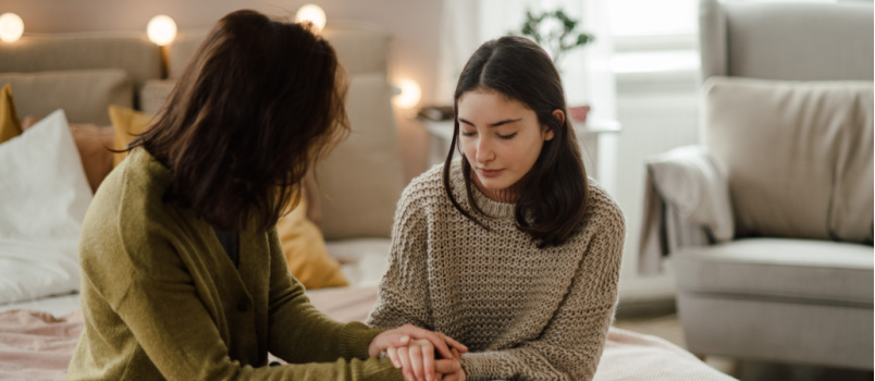 Girl sharing problem with mother