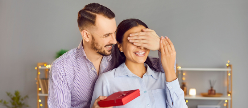 Man giving gift to woman