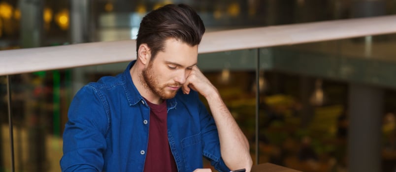 Man having coffee in restaurant