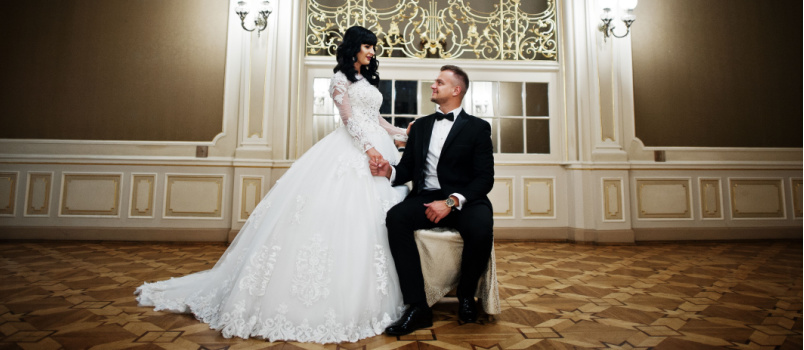 Newly wed couple sitting on chair