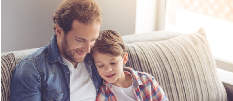 Father and son reading book