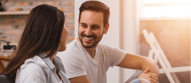Smiling couple looking at each other