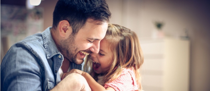 Father and daughter playing  together